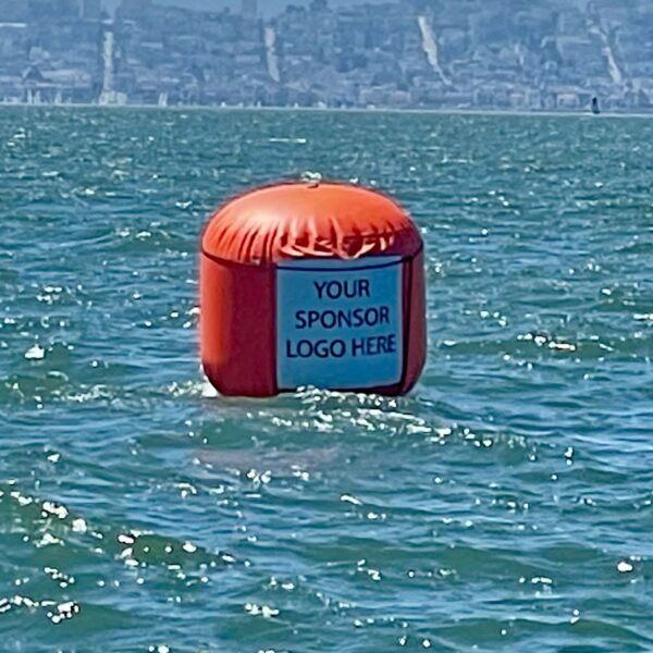 A buoy floating in the middle of a body of water.